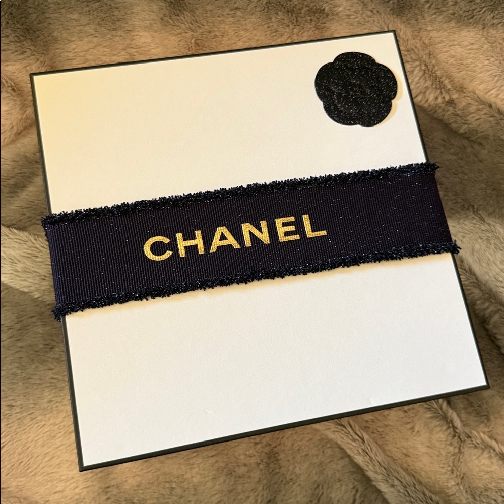 CHANEL storage box with holiday theme ribbon